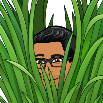 Bitmoji peaking behind tall grass